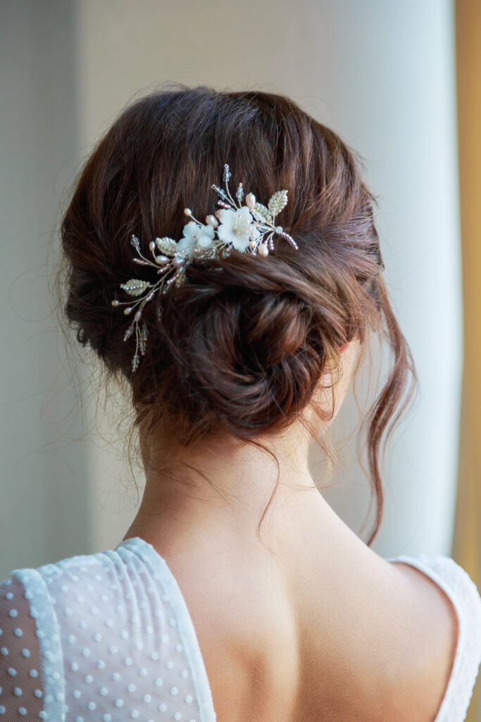 Close-up of a beautyful wedding hairstyle with  hair decoration.