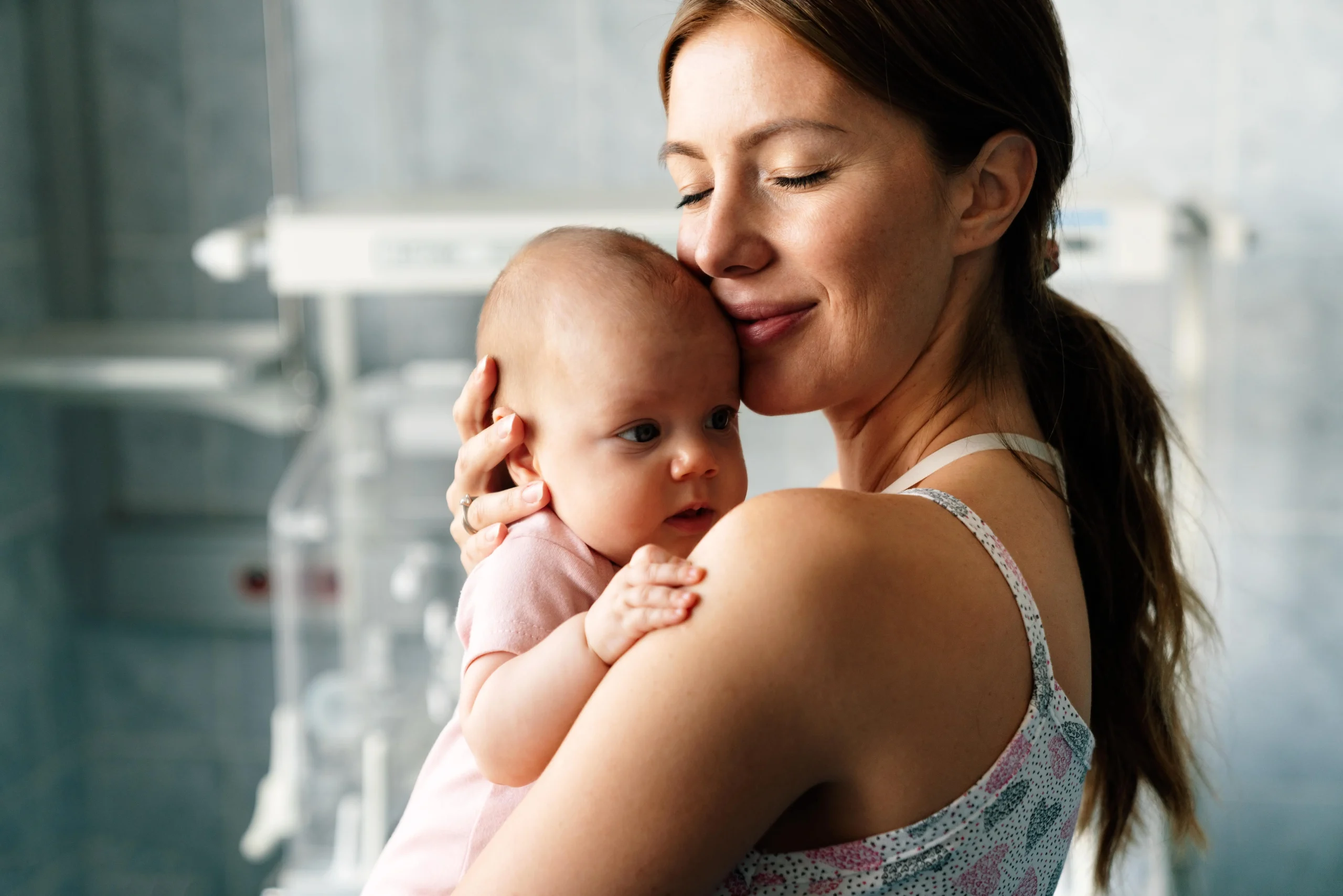 Mother-and-baby-kissing_-laughing-and-hugging-feeling-loved-and-rejuvanated-after-baby-massage-sessi