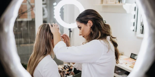 Makeup-process.-Professional-artist-applying-make-up-on-client-face-at-home