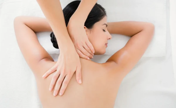 Woman-receiving-a-back-massage-at-home