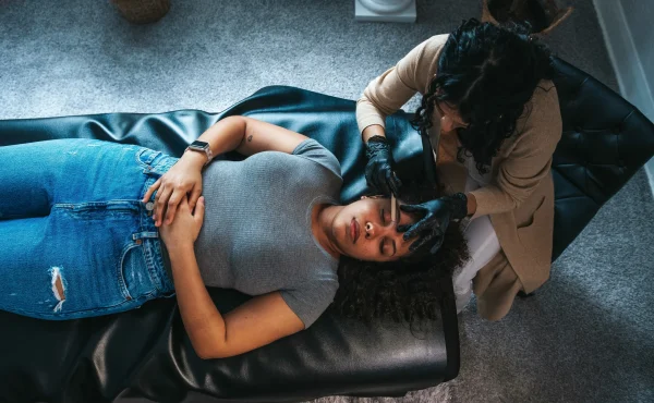 Woman-receiving-brows-treatment-at-home