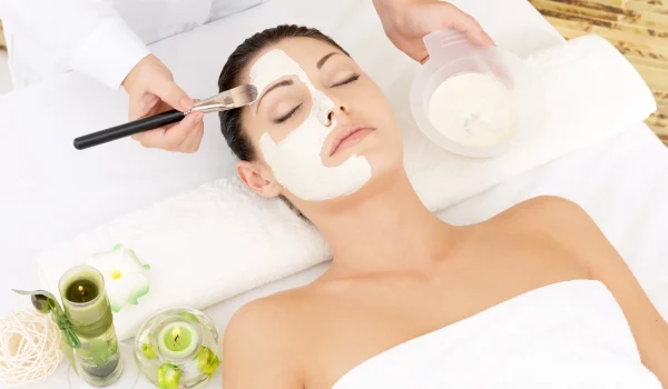 young-woman-spa-salon-with-cosmetic-mask-face-high-angle-photo